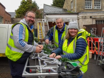 Group of people installing Christmas Lights