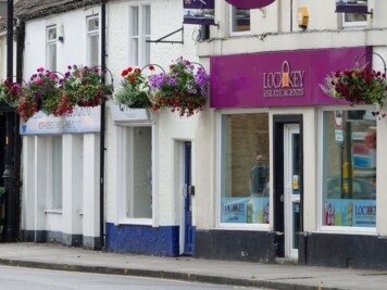 Business premises Church Street Melksham with floral Hanging Baskets