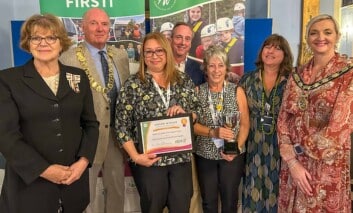 Saffi Rabey and other team members celebrating their Community First award