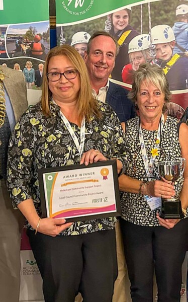 Saffi Rabey and other team members celebrating their Community First award