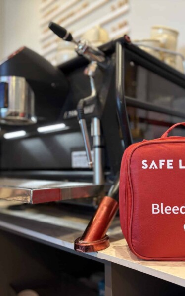 Bleed kit in front of a barista coffee machine at Evie’s Cafe