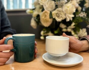 International Friendship Day. Holding coffee cups.
