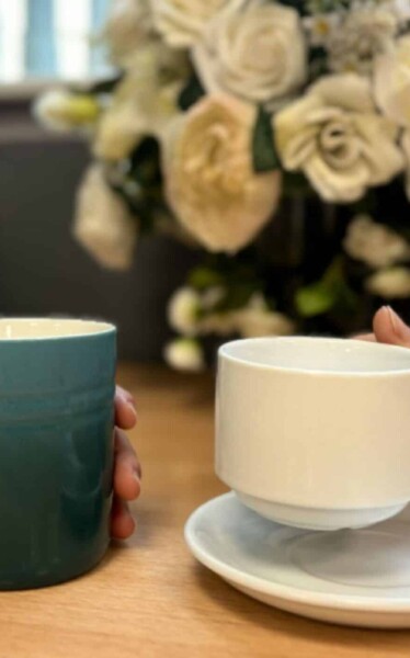 International Friendship Day. Holding coffee cups.
