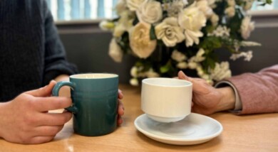 International Friendship Day. Holding coffee cups.