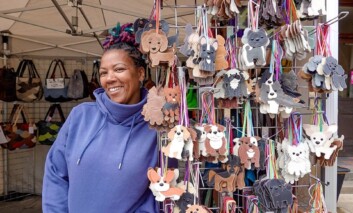 Stall holder at Melksham Makers&rsquo; Market selling leather goods.