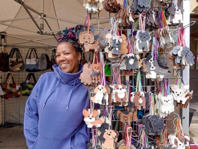 Stall holder at Melksham Makers&rsquo; Market selling leather goods.