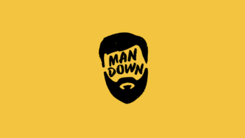 Man Down logo - a drawing of a man’s head with beard.