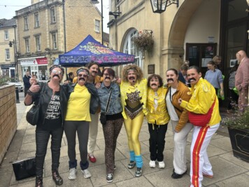 Group dressed like Freddie Mercury for Flash Mob