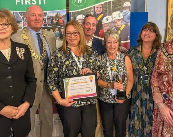 Saffi Rabey and other team members celebrating their Community First award